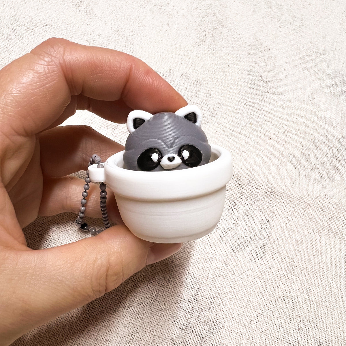Clicker Mapache Macetero