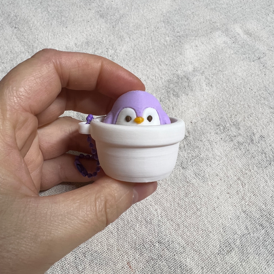 Clicker Pingüino Bebé Macetero